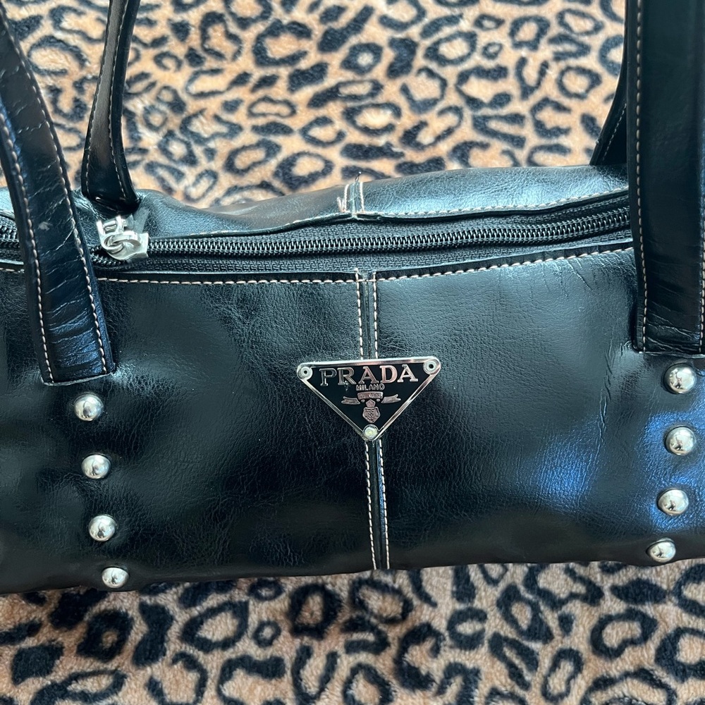 Small black leather purse. Designer label